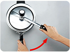 Opening step 2: swing the lid handle toward the body handle