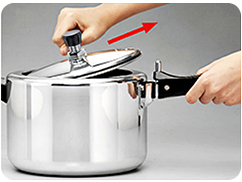 Opening step 5: grip the lid knob and steady the body